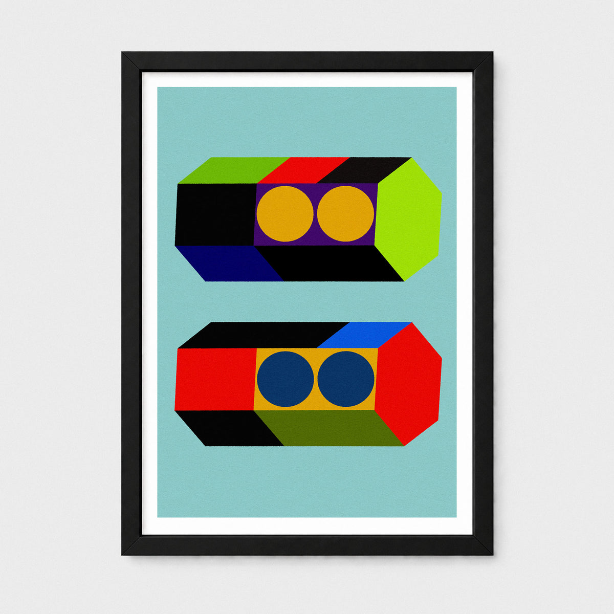 A framed art print featuring a colorful geometric design of two stylized cassette tapes on a light blue background, enclosed in a black frame with a white mat.