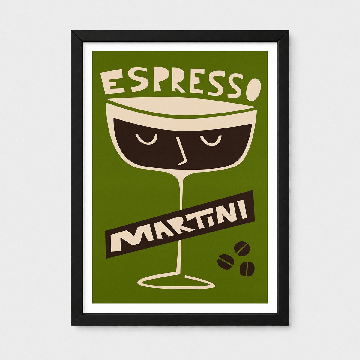 A framed art print featuring a retro-style illustration of an espresso martini glass on an olive green background, with the words 'ESPRESSO' and 'MARTINI' in cream and dark brown. The print is displayed in a black frame with a white mat against a light gray wall.