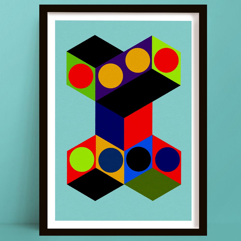 Framed abstract geometric wall art print featuring bold 3D cube shapes and circles in red, yellow, green, blue, purple, black, and orange on a light blue background, shown against a teal wall.