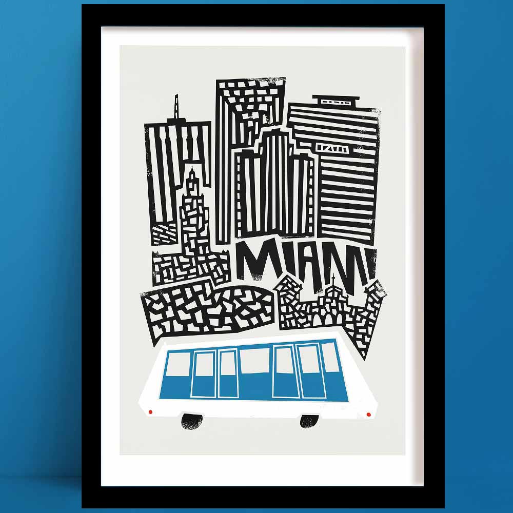A Miami print with a stylised black-and-white illustration of the city's skyline, with sharp geometric lines and a retro blue monorail adding a splash of colour and movement below.