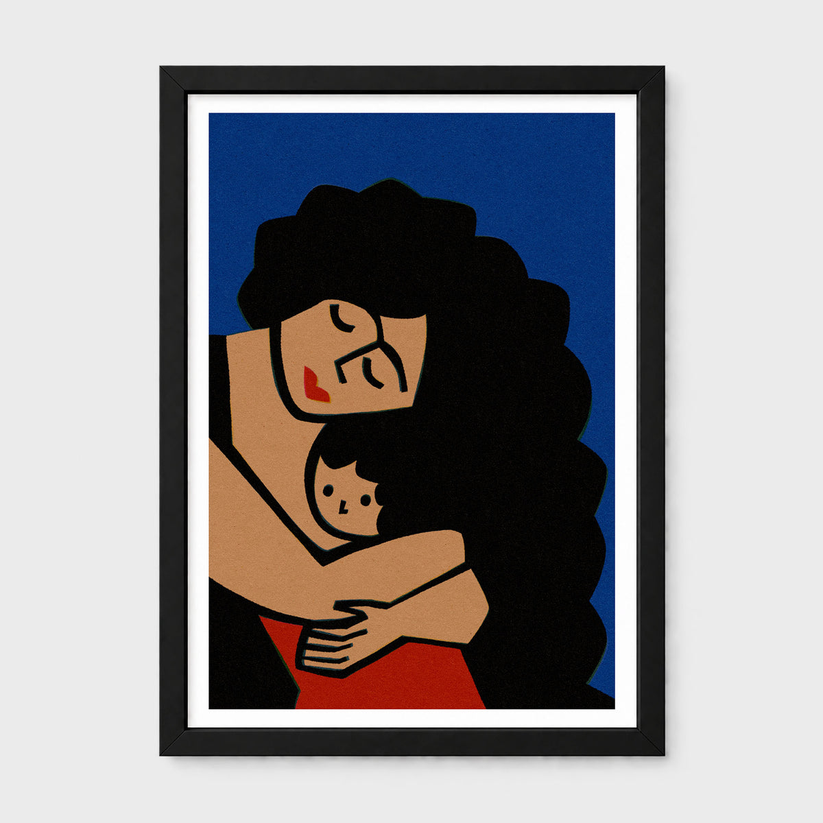 A framed art print featuring a stylized illustration of a woman with voluminous black hair hugging a small child, set against a deep blue background. The print is housed in a white mat and a sleek black frame, presented on a neutral light gray background.