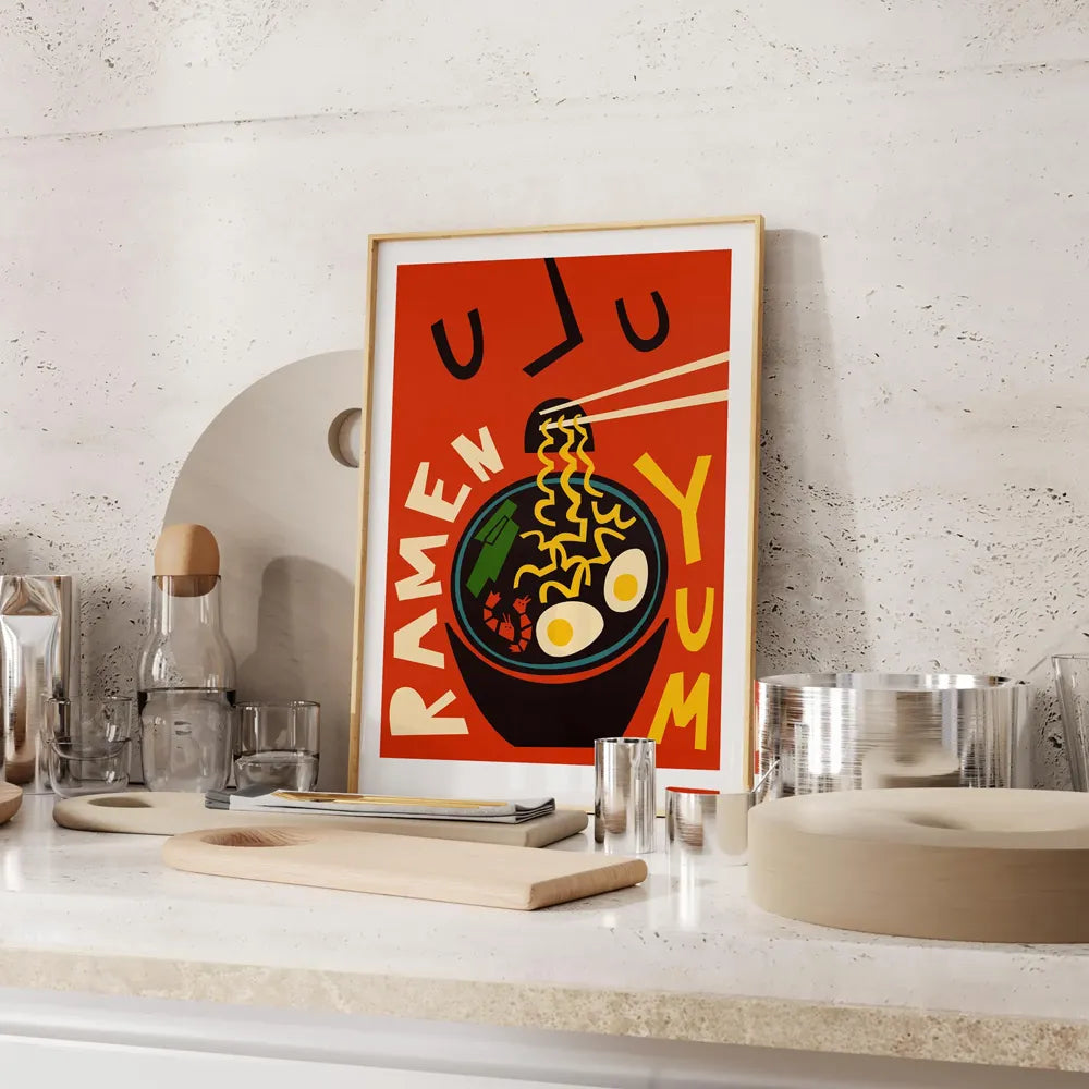 Ramen illustration print in wood frame resting on kitchen counter top
