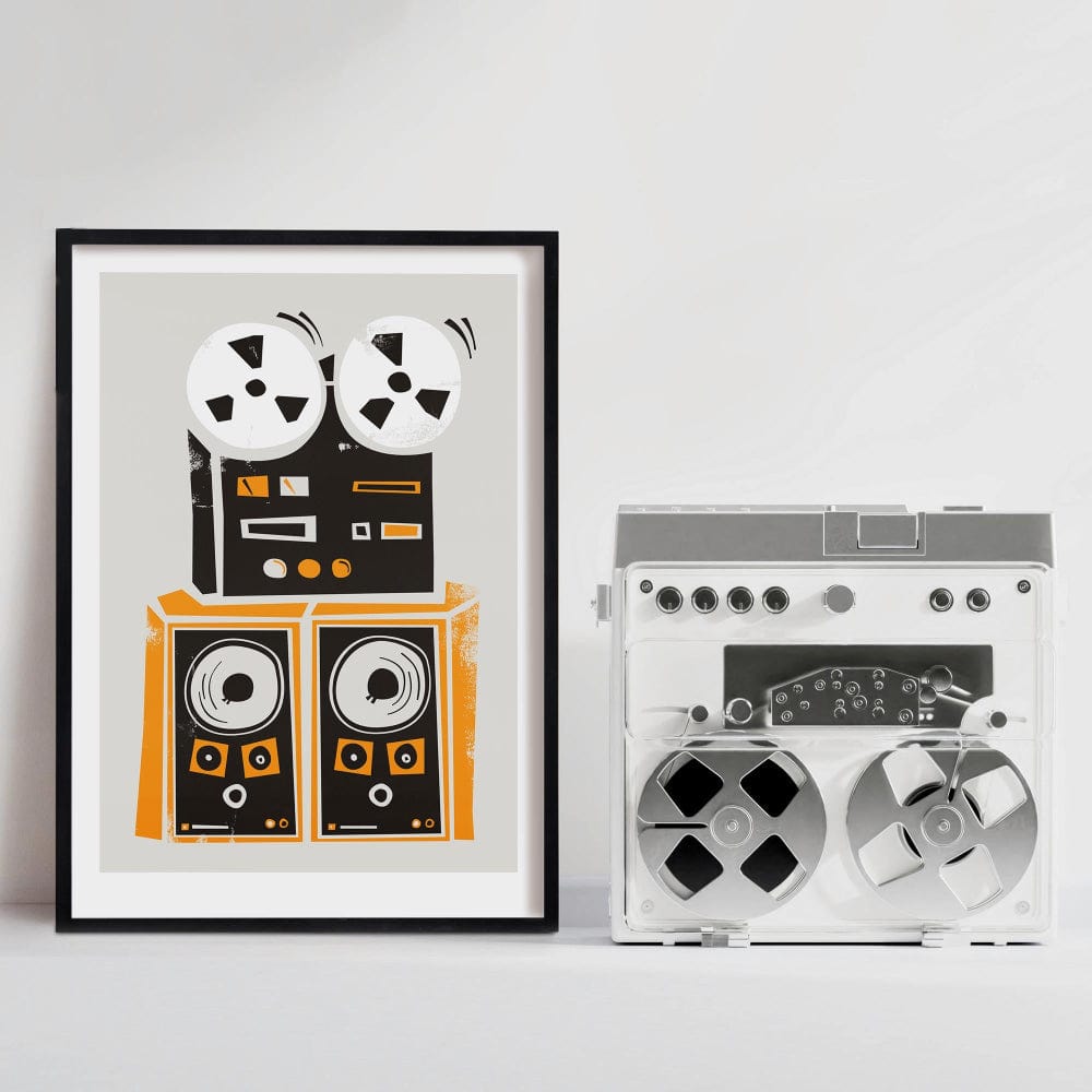 Reel-to-reel tape recorder art print hanging above a silver vintage stereo system in a white room