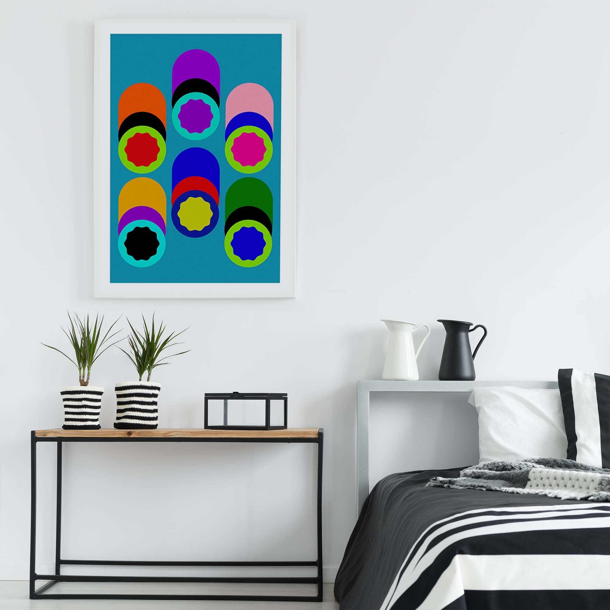 Modern bedroom with a colorful abstract painting on the wall, a bed with striped bedding, and a side table with plants and decor items.