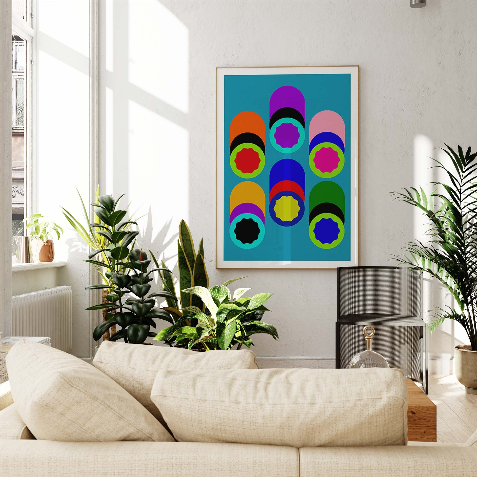Colorful abstract art piece on a wall in a living room with plants and a sofa.
