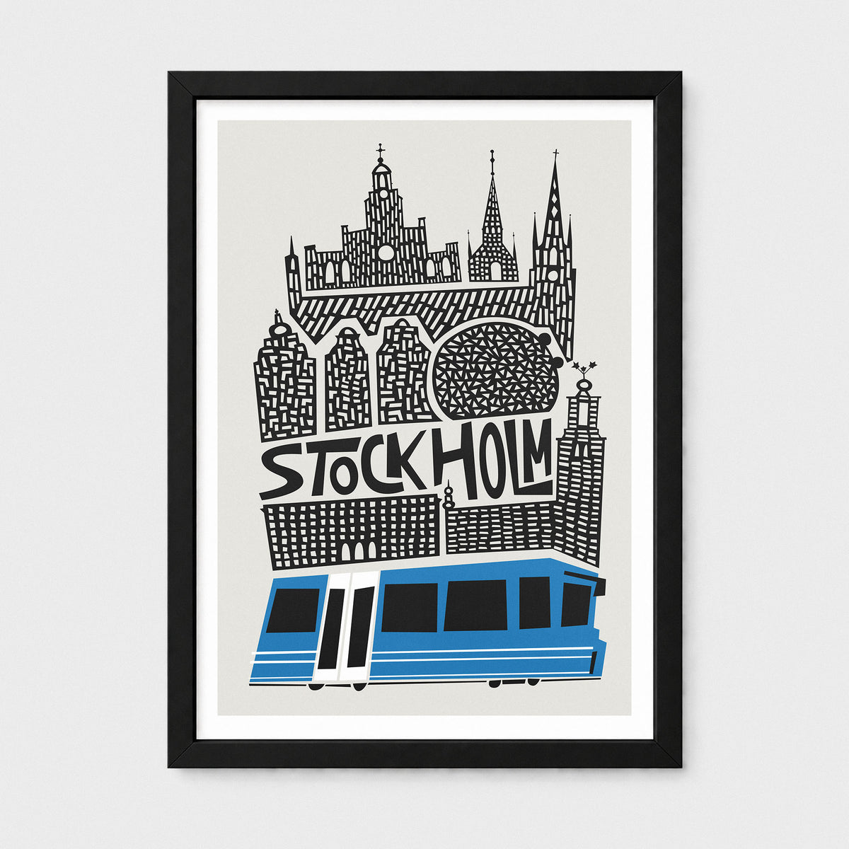 A framed art print featuring a stylized black and white illustration of Stockholm landmarks and a blue tram on a light gray background, displayed in a black frame against a light gray wall.