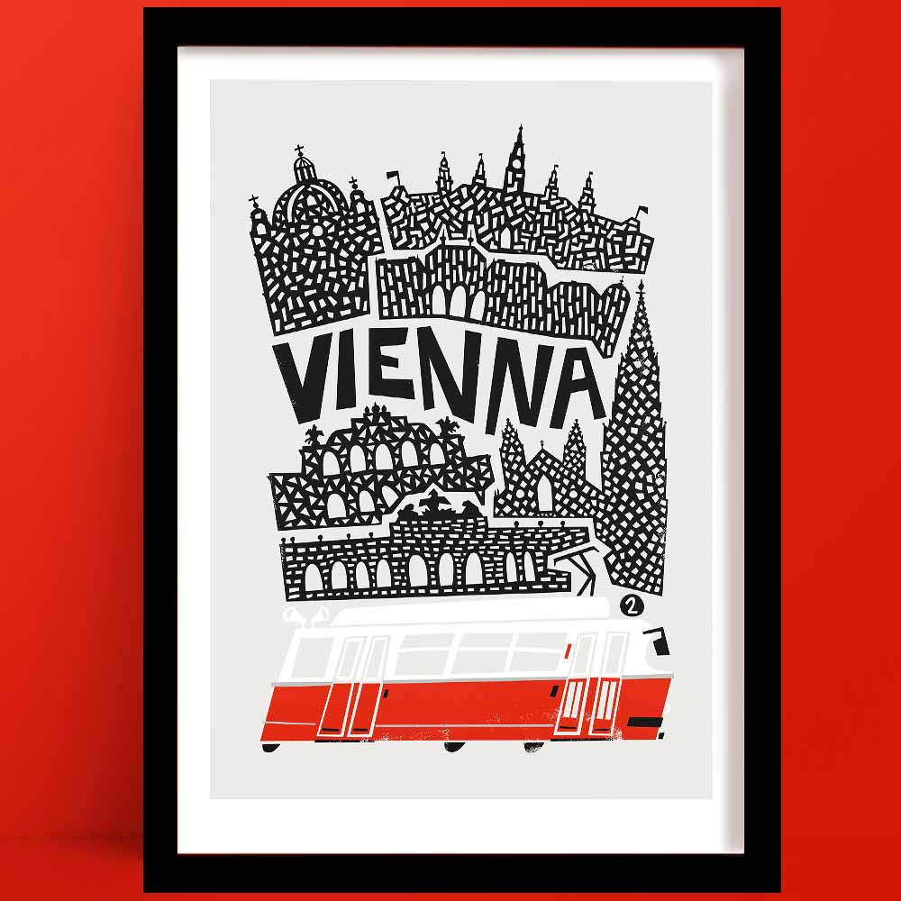 A Vienna print with a black and white illustration of the city's skyline, featuring iconic architecture and a red city tram.