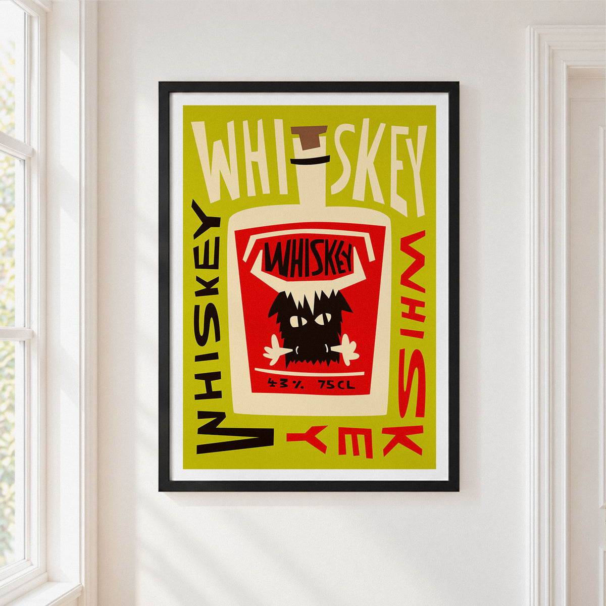 A framed art print featuring a retro-style whiskey bottle illustration with bold text, hung on a white wall next to a window.
