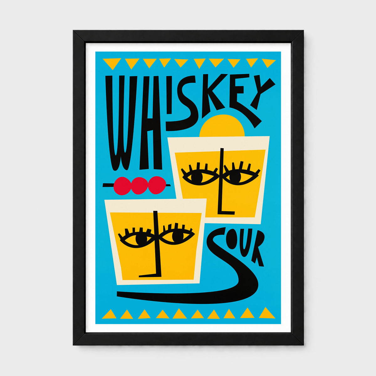 A framed graphic art print featuring a stylized illustration of two glasses of yellow whiskey with faces, black text reading 'WHISKEY SOUR', and a bright blue background, shown in a black frame against a light gray wall.