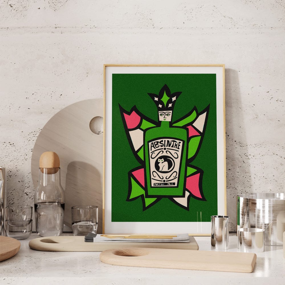 Absinthe artwork styled on a stone wall shelf with cocktail glasses and barware.
