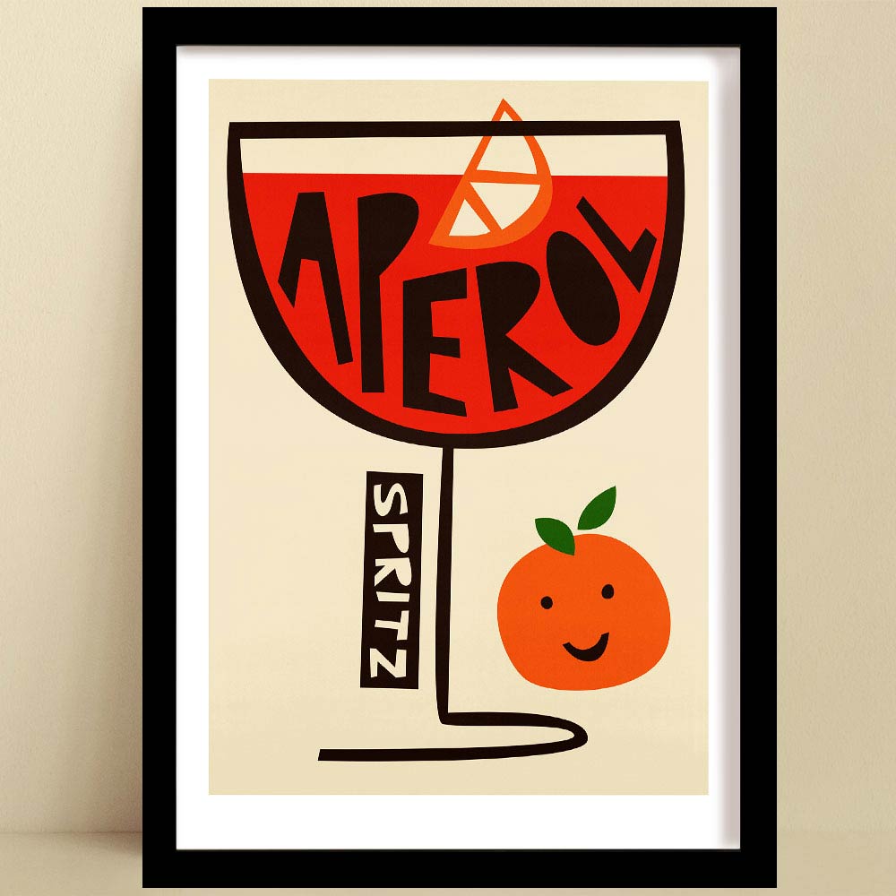 A bold Aperol Spritz print with an illustration of a playful typographic smiling orange, on a neutral wall.