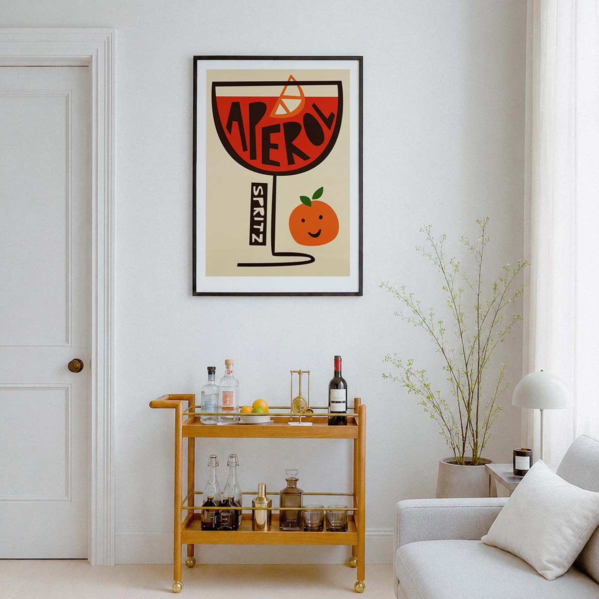 Framed aperol spritz print above a wooden drinks catt