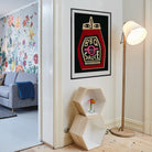 BBQ Sauce poster framed on a clean white wall near a modern lamp and pastel hallway.