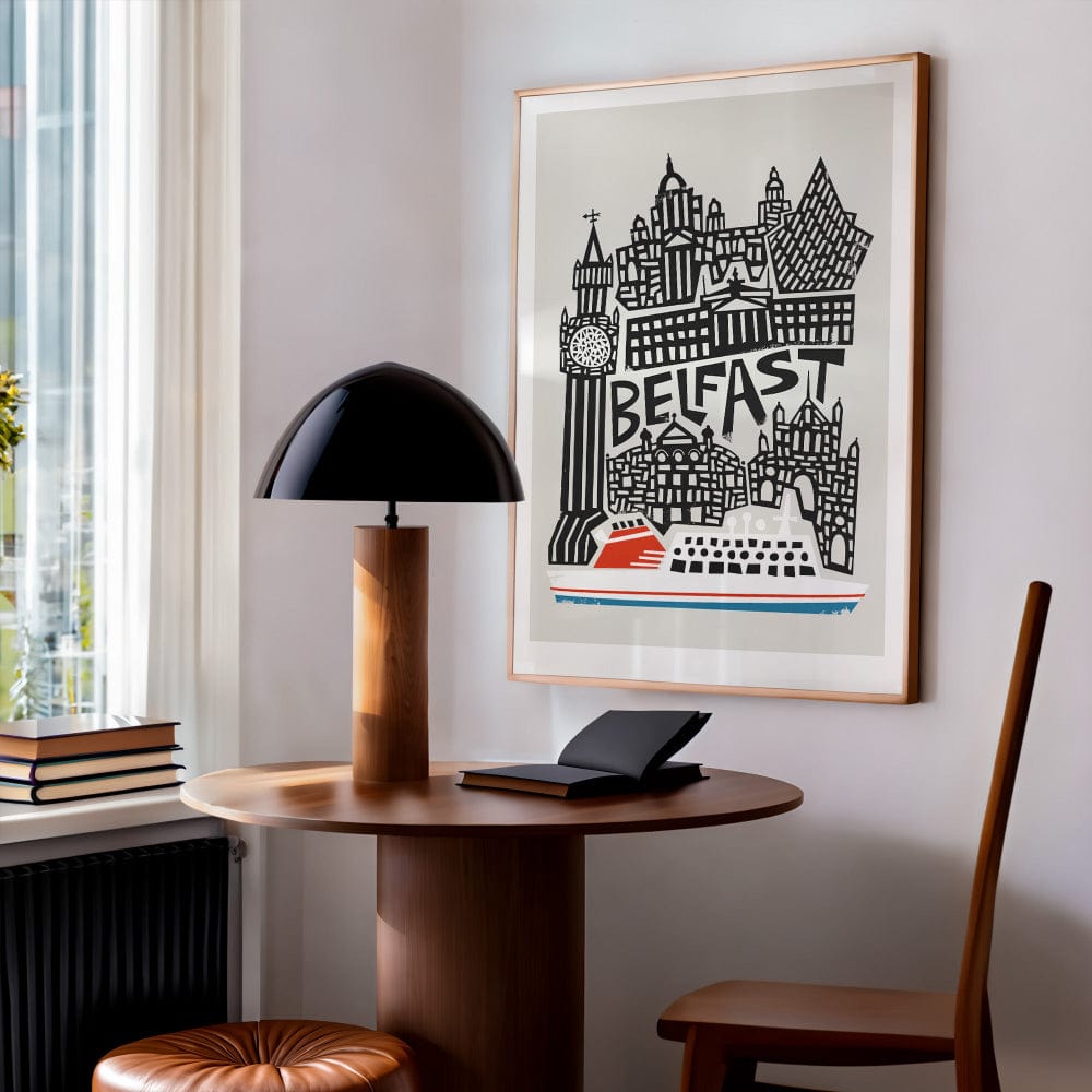 The Belfast city art print styled in a cosy corner studio, its dynamic composition and monochrome skyline energising the space with urban flair.