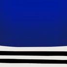 Close-up of cobalt blue block and curved black linework on white background