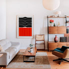 Ember art print framed in a stylish living area, with its striking colour blocks and simple form providing a graphic focal point in a cosy contemporary home.