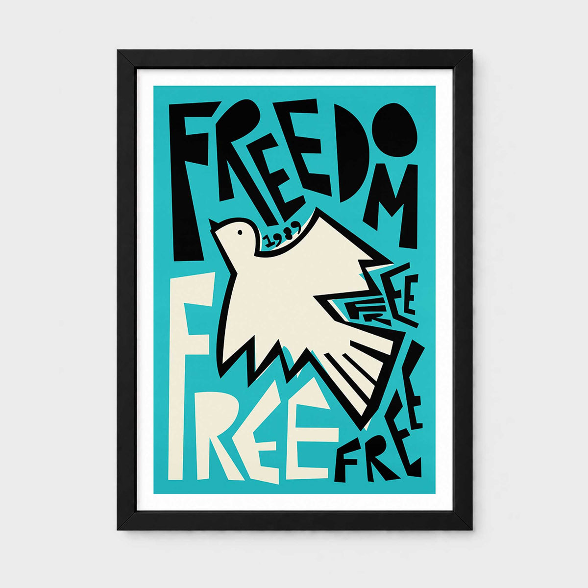 A framed art print featuring a stylized white dove and the lettering typography 'FREEDOM' and 'FREE' in bold black lettering on a turquoise background, shown against a light gray wall.