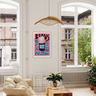 Humorous bean-themed art print displayed in a bright lounge interior.