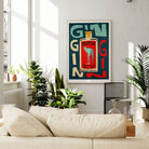 Gin-themed wall art framed in a bright, leafy living room with modern decor.
