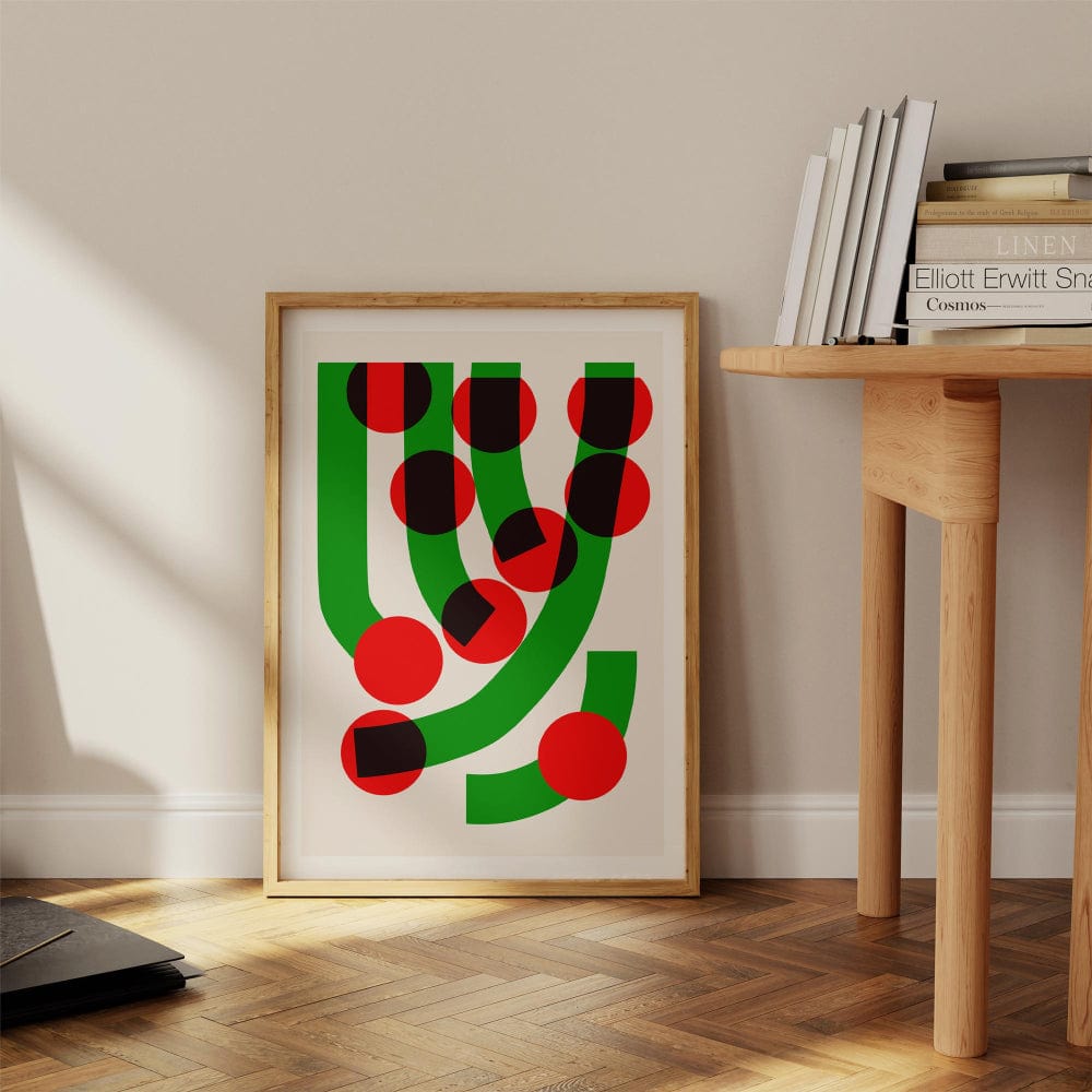 The Green Grass abstract print styled casually on the floor against a minimalist wall, radiating retro energy and a hint of graphic mischief.