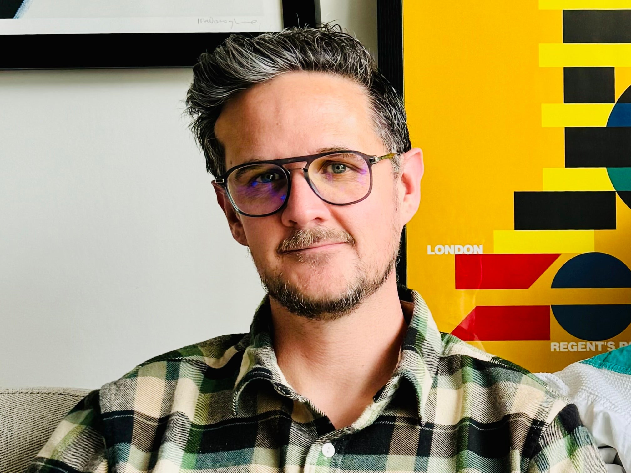 A headshot of Mark posing for the camera.