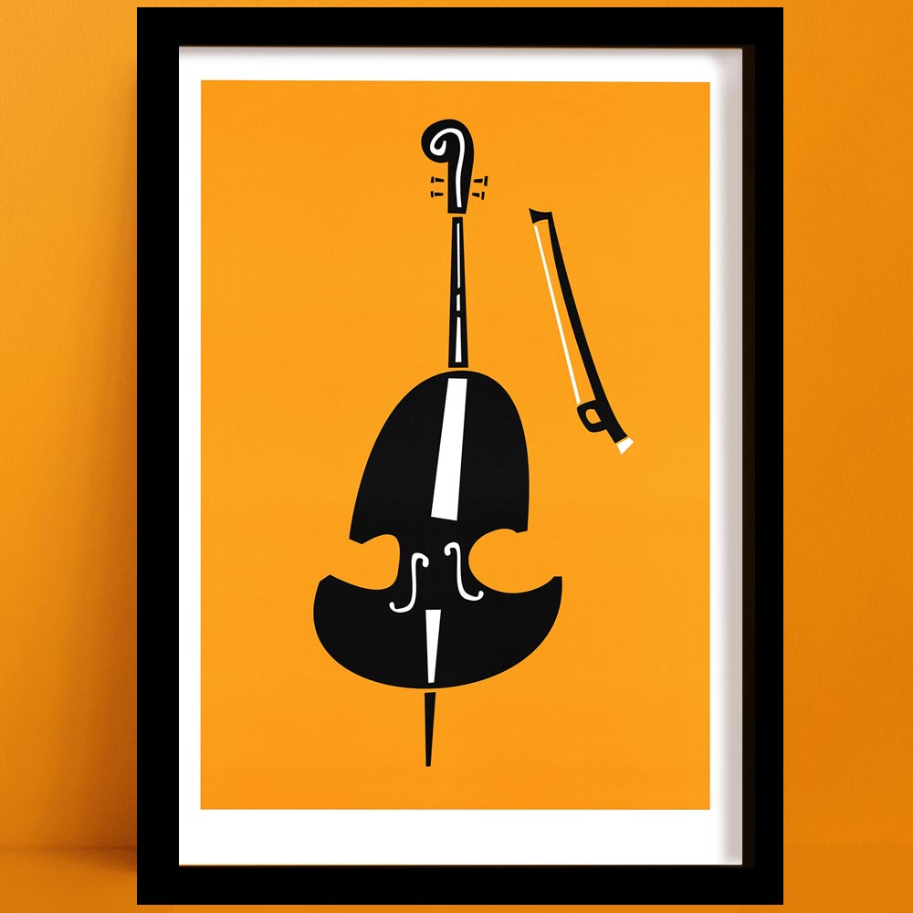 Framed abstract double bass print with bold orange background and stylised black and white shapes, displayed on an orange wall