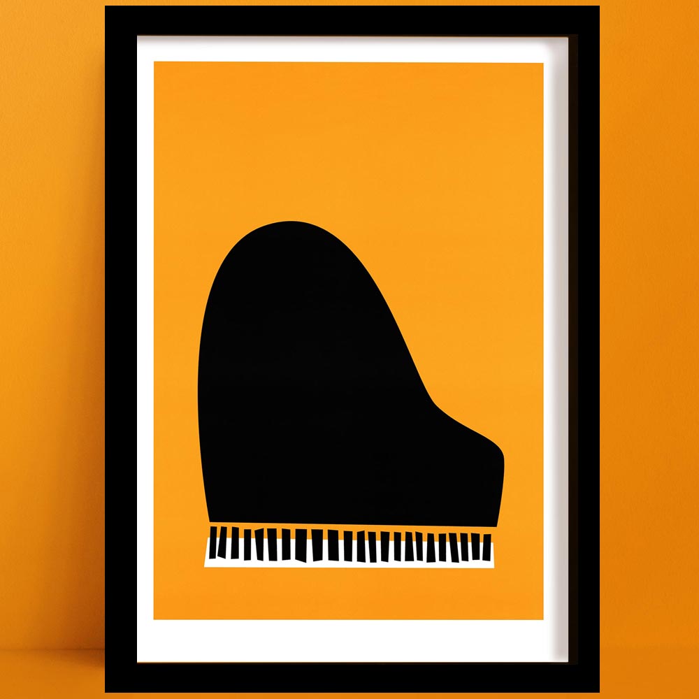 Framed minimalist jazz piano print with bold orange background and black piano shape, displayed on an orange wall