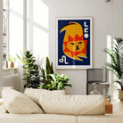 Leo zodiac poster framed above a cream sofa in a bright, plant-filled living space with natural light.