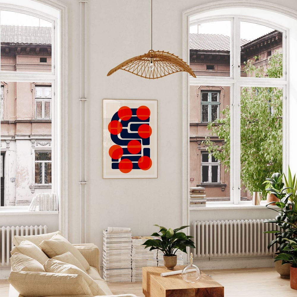 Many Suns hung above a soft-toned sofa, its strong geometric contrasts grounding the space while injecting a vibrant pop-art sensibility into the decor.