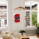 Many Suns hung above a soft-toned sofa, its strong geometric contrasts grounding the space while injecting a vibrant pop-art sensibility into the decor.