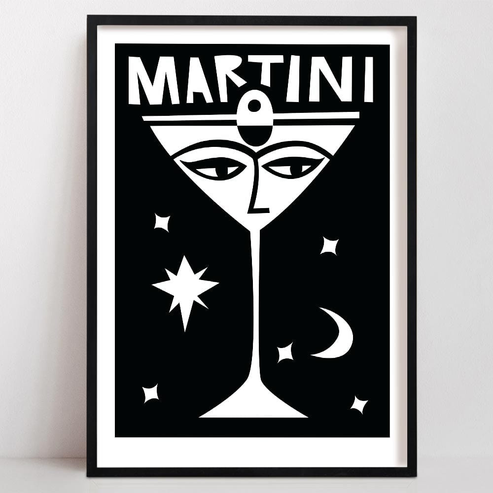 our martini print with Striking black and white art print of a martini glass with a stylised face, surrounded by celestial motifs including stars and a crescent moon.
