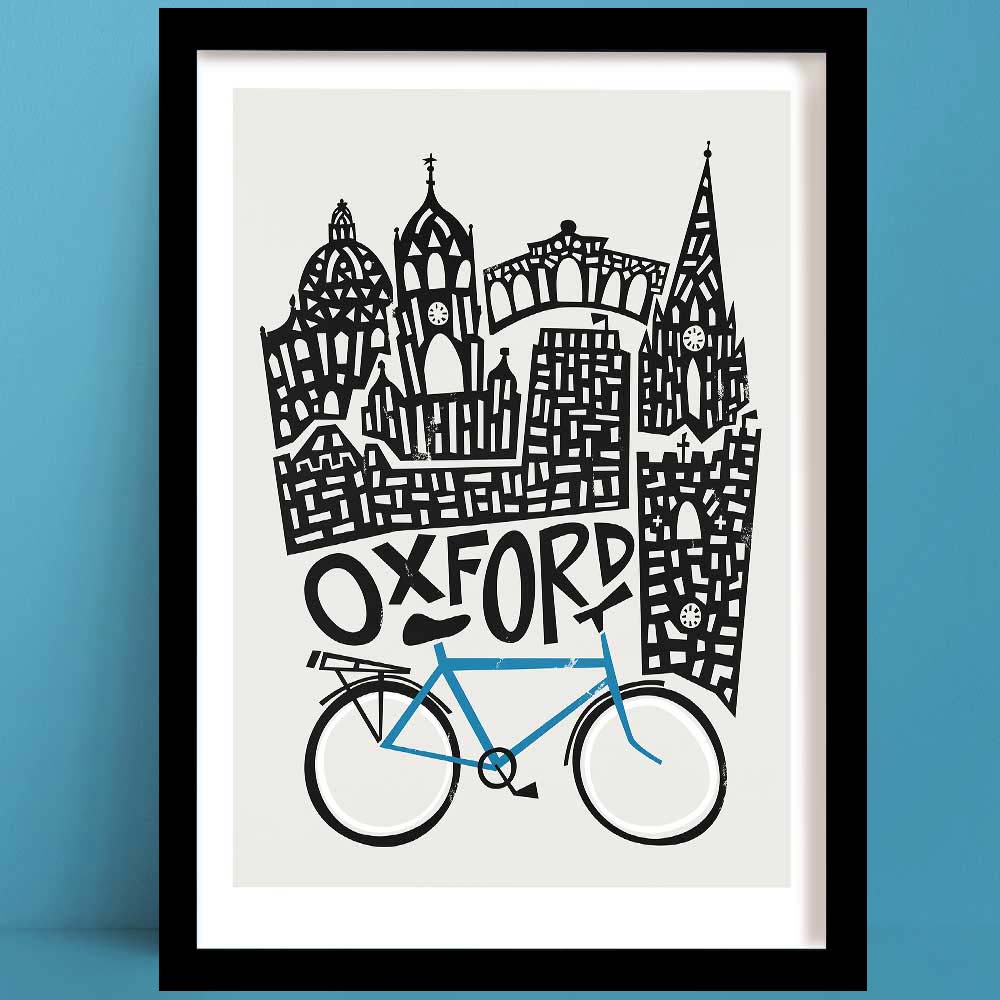 An Oxford print featuring a monochrome illustration of the city's iconic skyline, featuring a hand-drawn bicycle in blue, symbolising the city’s academic spirit and beloved cycling culture.