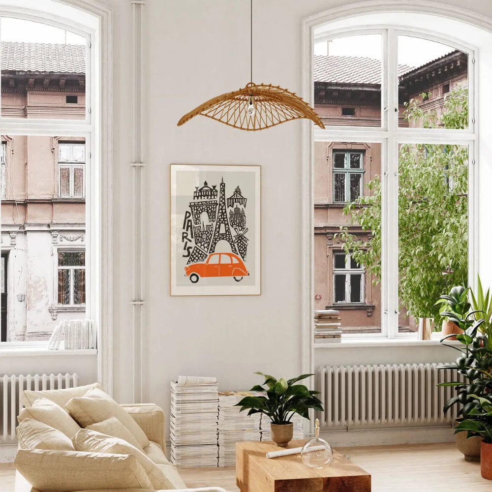 The Paris art print displayed in a sunlit interior with arched windows, plants, and natural textures, lending a relaxed European elegance to the space.