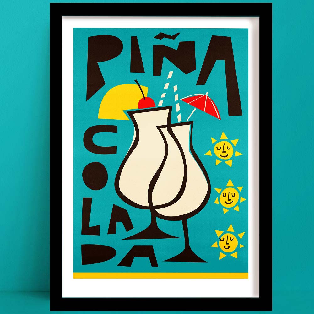 Fun piña colada print with playful type, cherry-topped drink, and smiling suns, framed on teal wall.
