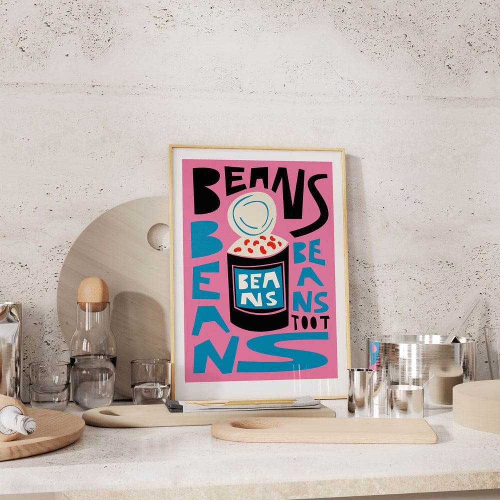 Framed retro beans artwork styled casually in a modern kitchen space.
