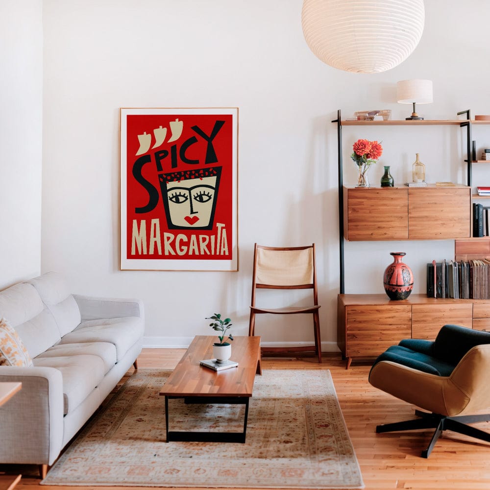 The framed Spicy Margarita print hangs in a chic, modern living space with warm wood accents and mid-century furnishings, adding instant attitude to the decor.