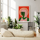 Sun halo portrait framed above cream sofa, styled with lush indoor plants and natural light