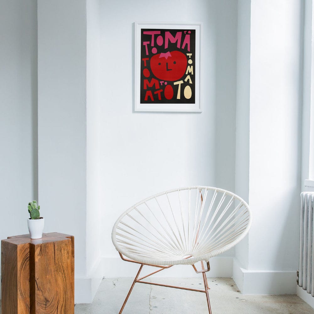 Tomato-themed wall print displayed in a minimalist interior with natural light.