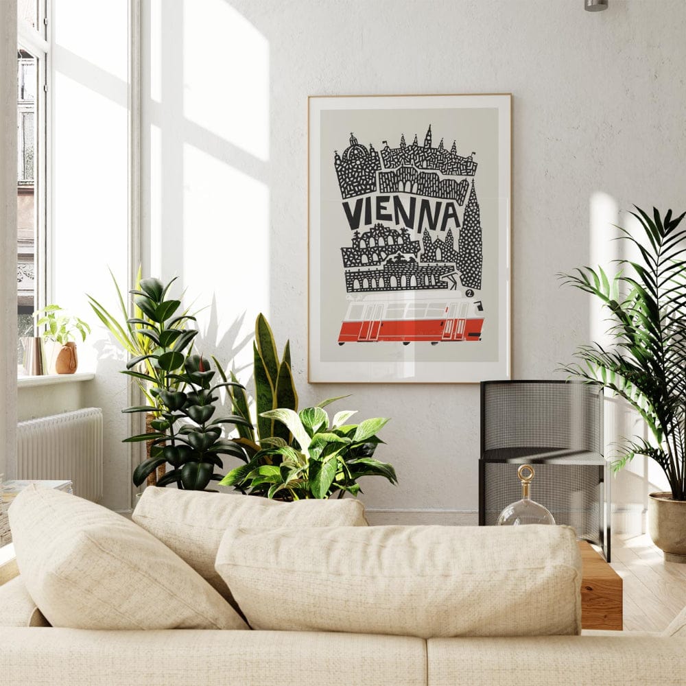 The Vienna city print displayed in a bright living room, hung above a neutral-toned sofa with natural light.
