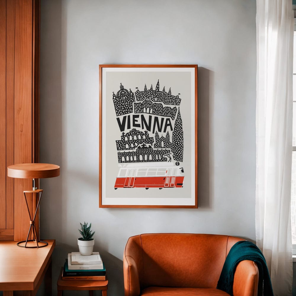 Vienna skyline print in a wooden frame, styled in a modern interior with an armchair and minimal decor.