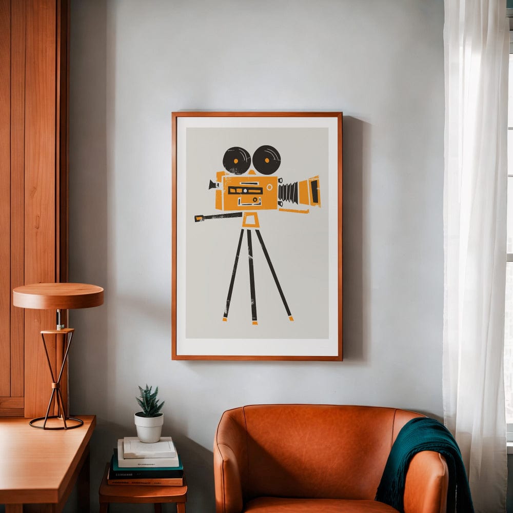 The vintage cine film camera print hangs above a rust-toned chair, its golden hues and graphic lines adding a stylish, cinematic feel to the cosy interior.