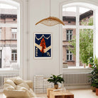 Virgo zodiac print framed in a bright, airy interior with large windows and indoor plants.