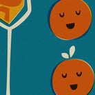 Close-up view showing the playful orange faces and the elegant stem of a champagne flute filled with bubbly orange text.