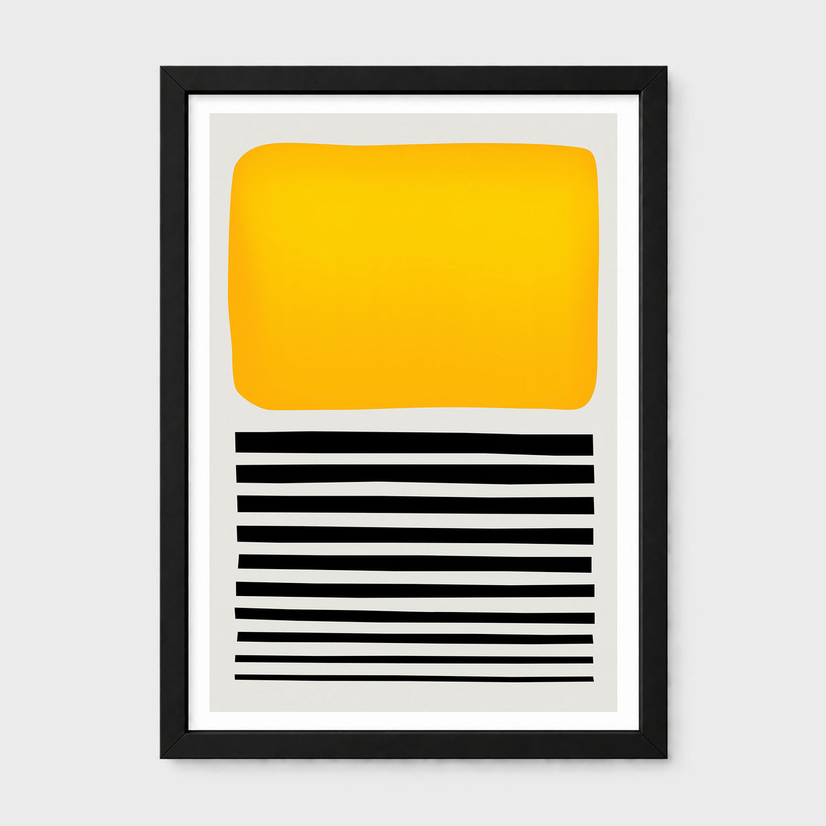 A framed abstract art print featuring a large yellow-orange block on a light gray background with horizontal black stripes below, set in a black frame against a light gray wall.