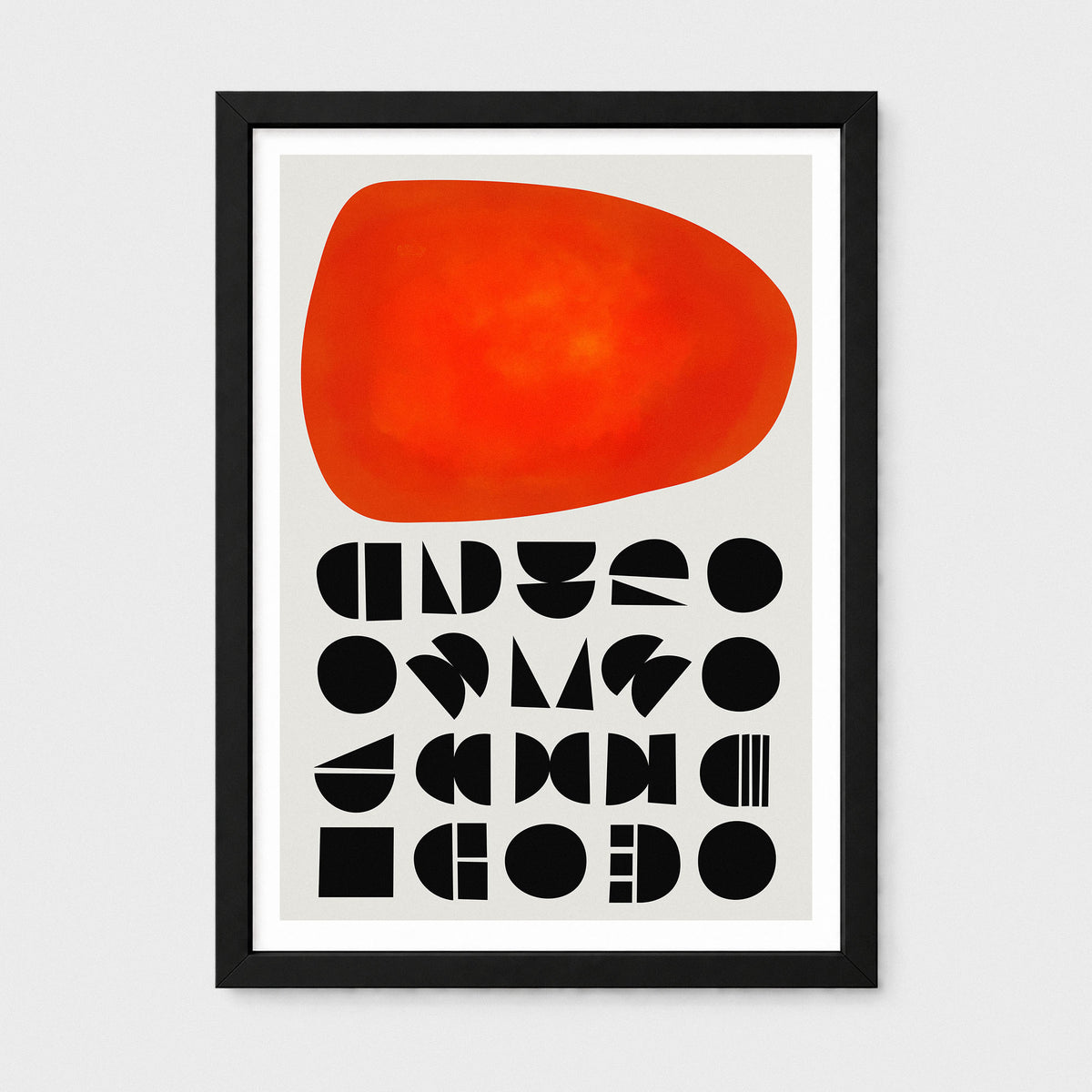 A framed abstract art print featuring a large textured orange-red organic shape at the top and rows of black geometric shapes below on a light gray background, enclosed in a black frame with a white mat.