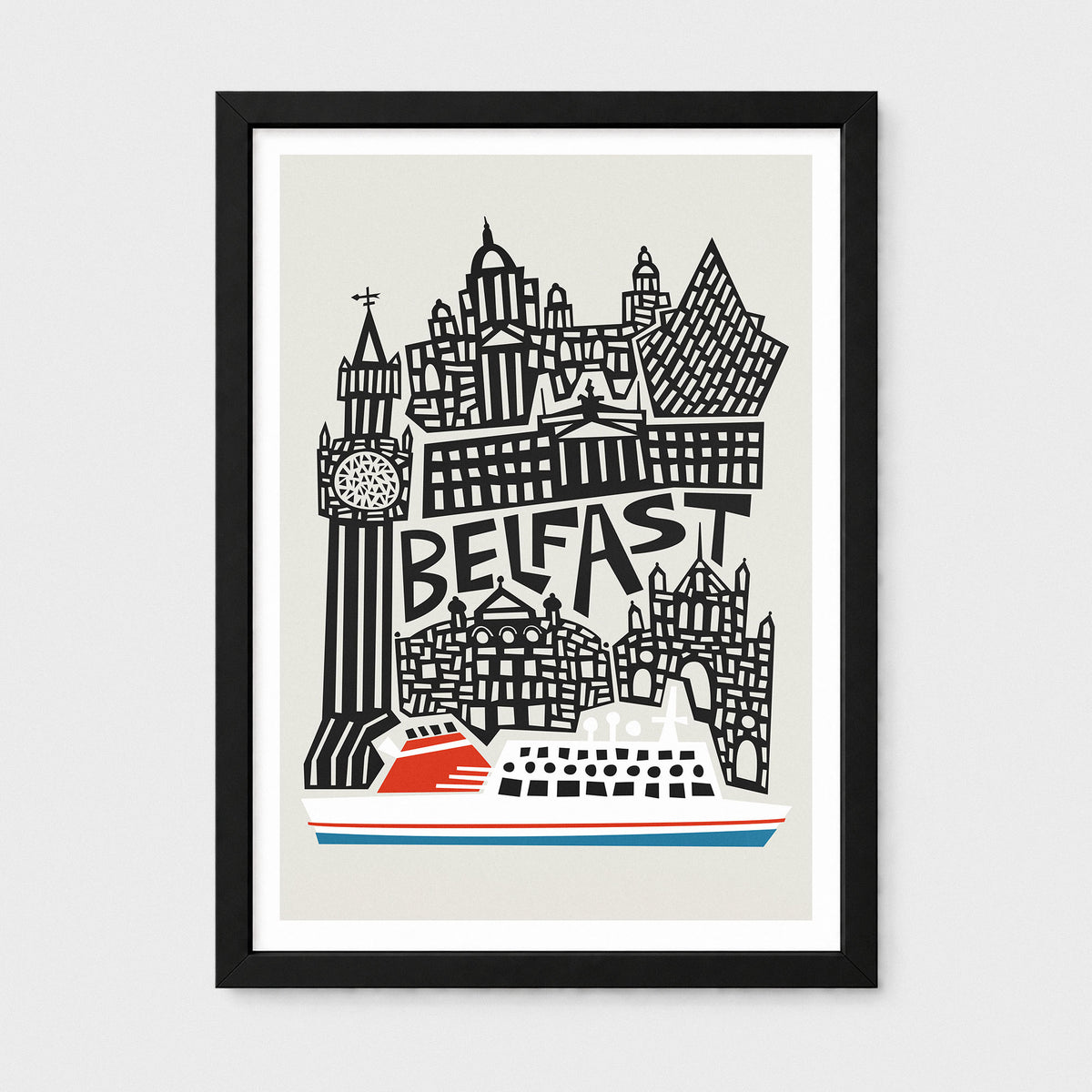 A framed art print featuring a stylized black and white illustration of the Belfast skyline with the word 'BELFAST' in the center and a red-and-white cruise ship at the bottom. The print is shown in a black frame with a white mat against a light gray background.