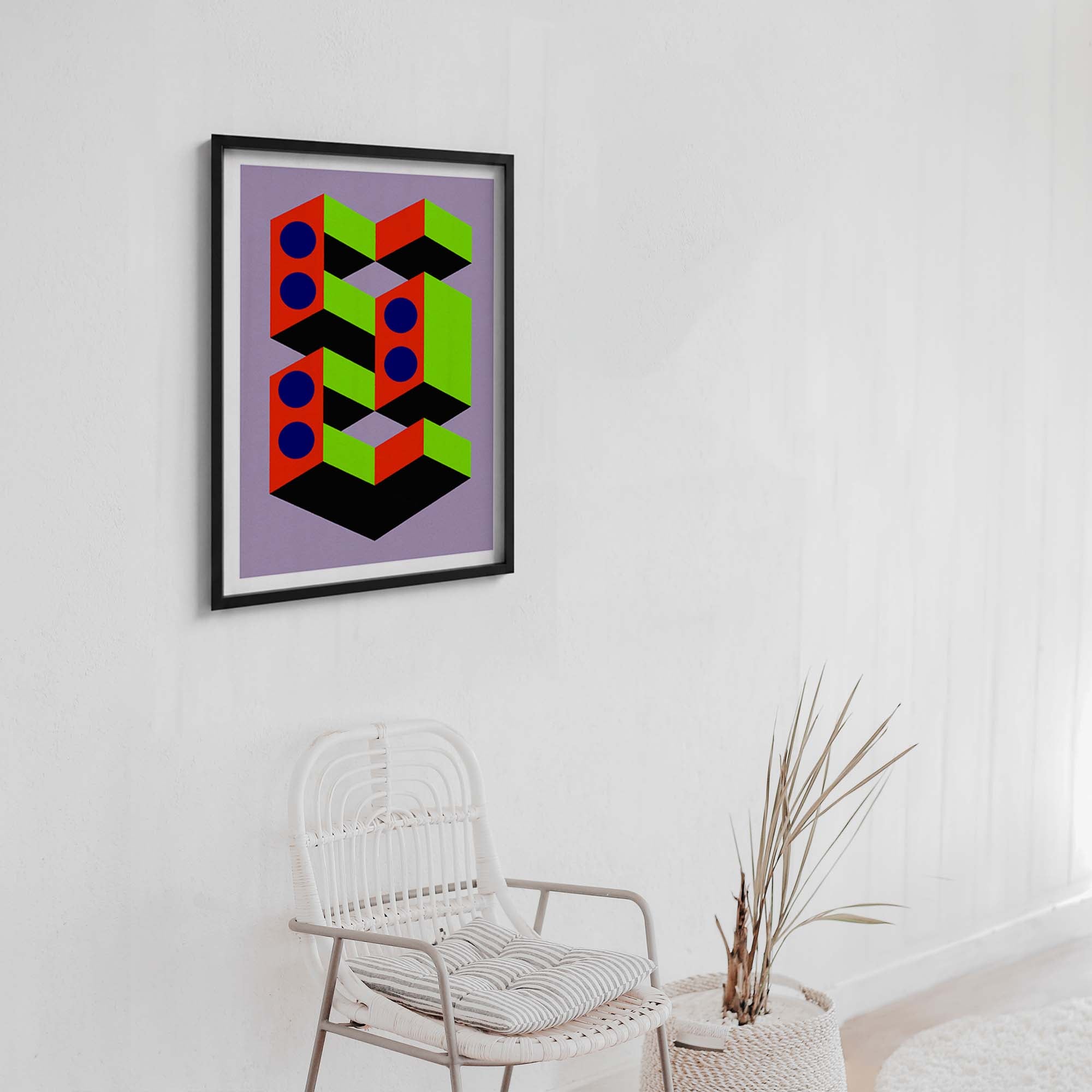 Geometric abstract art print on a wall above a chair