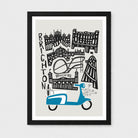 A framed art print featuring a stylized black and white illustration of Brighton landmarks with a blue scooter at the bottom, shown against a light gray background.