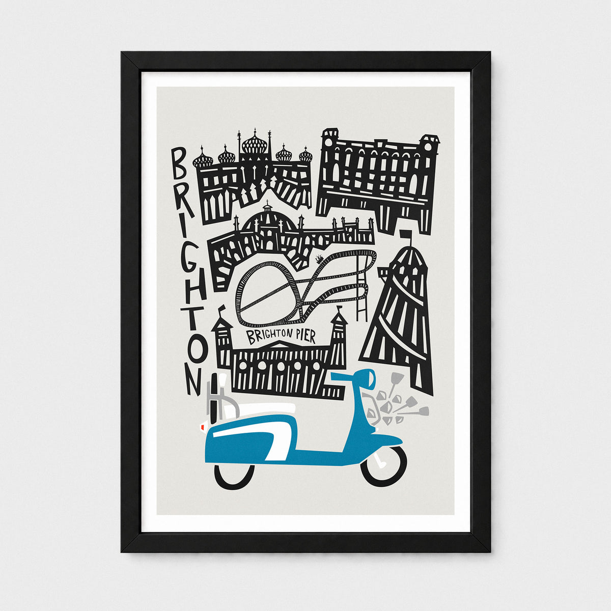 A framed art print featuring a stylized black and white illustration of Brighton landmarks with a blue scooter at the bottom, shown against a light gray background.