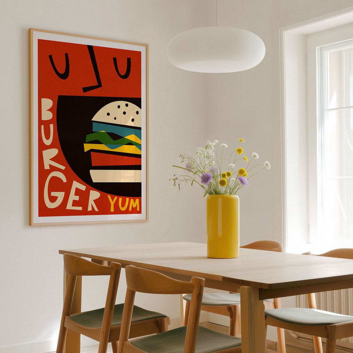 A framed retro-style poster print featuring a stylized burger illustration with the words 'BURGER YUM' in a sun lit dining room.